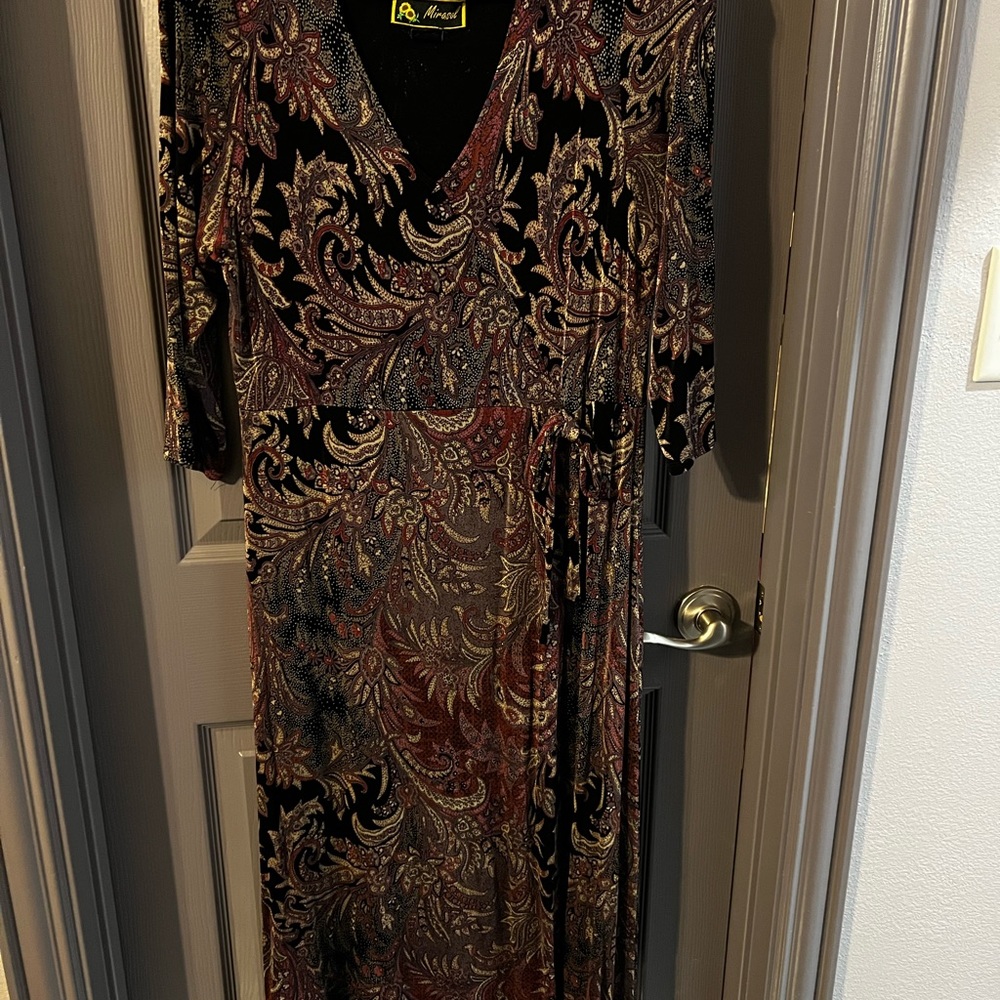 Beautiful classy below the knee, stretch knit dress.